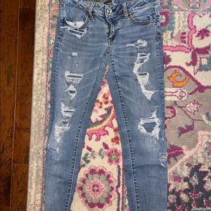 American eagle super stretch covered ripped jeans.